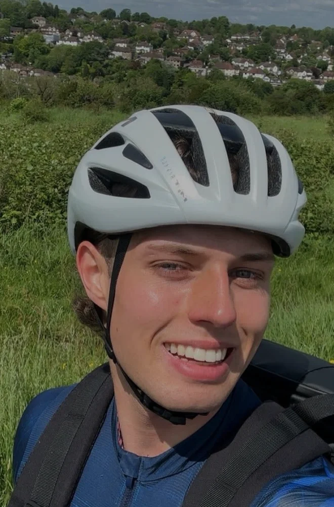 An AMA member cycling outdoors